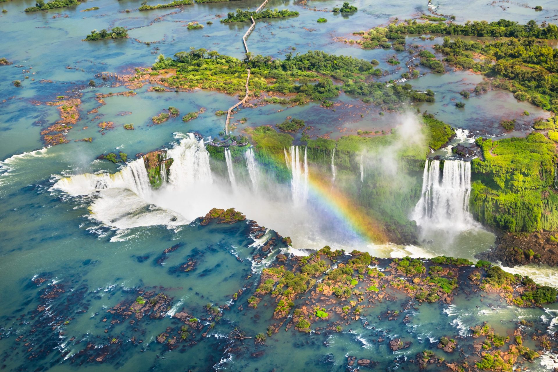 the Iguazu Falls is a series of 275 waterfalls huddled close together and f...